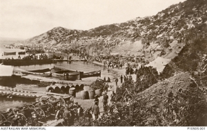 Stores, limbers and soldiers on Anzac Beach at Anzac Cove